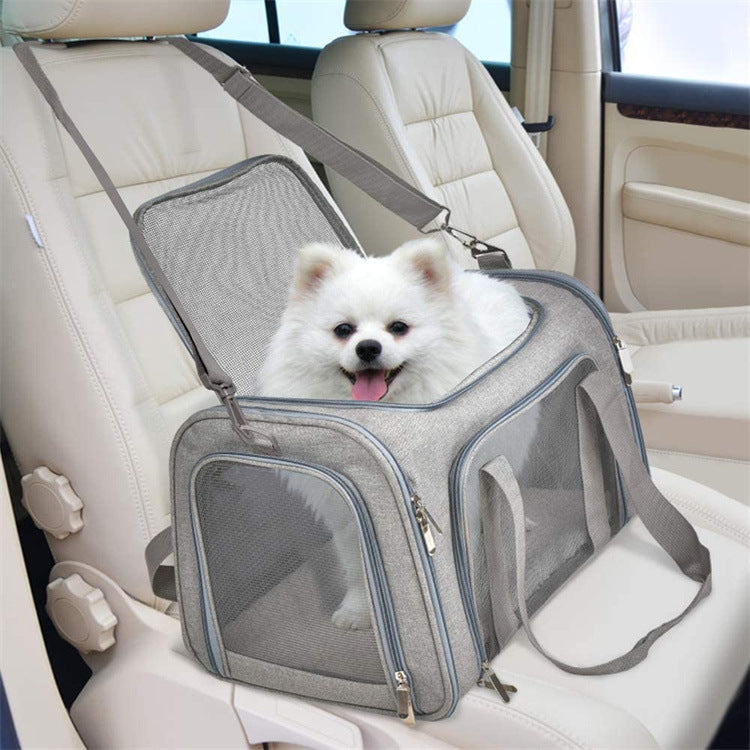 Small dog travelling in the DODOROAM Carryall on a car seat